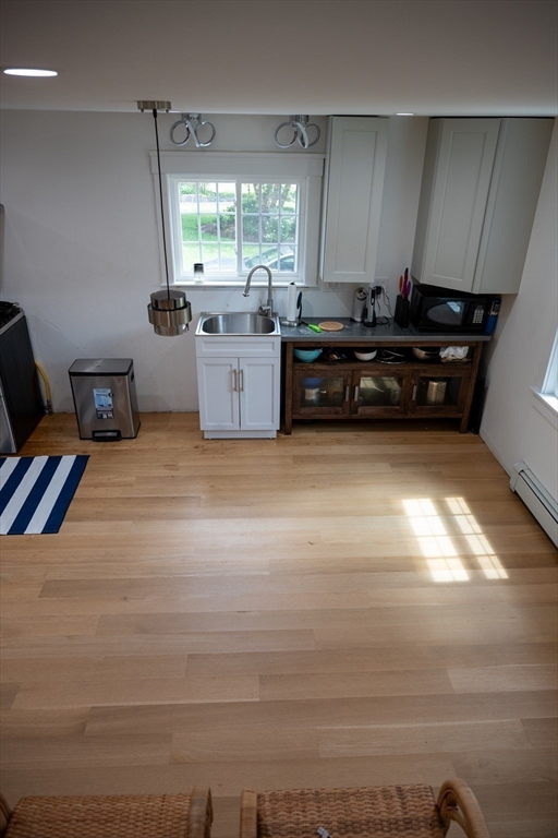 20 Hemlock Drive Canton, MA 02021 - Photo 6 of 14 a kitchen with granite countertop a stove and a refrigerator