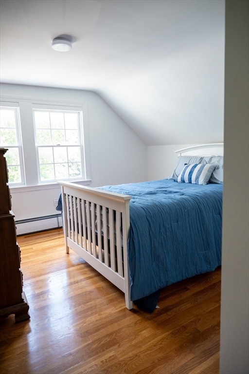 20 Hemlock Drive Canton, MA 02021 - Photo 9 of 14 a bedroom with a bed and wooden floor
