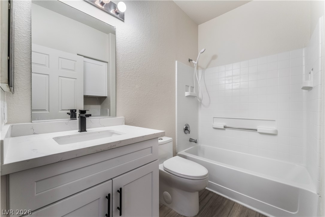 4730 East Craig Road, Unit 1058 Las Vegas, NV 89115 - Photo 18 of 30 A well-appointed bathroom features a crisp white vanity and modern fixtures.