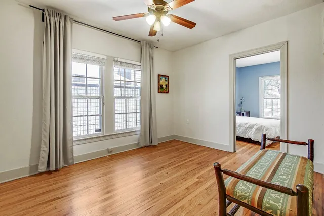 a view of a kitchen with a sink and dishwasher a refrigerator with wooden floor
