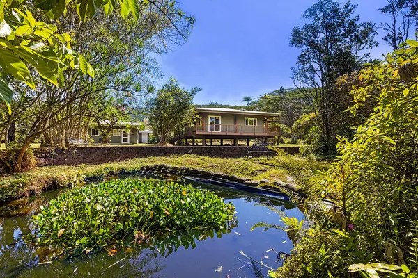 a view of yard with swimming pool and green space