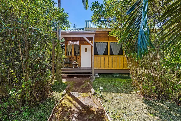 front view of a house with a yard