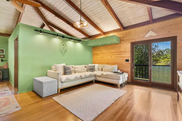 a balcony with furniture and a potted plant