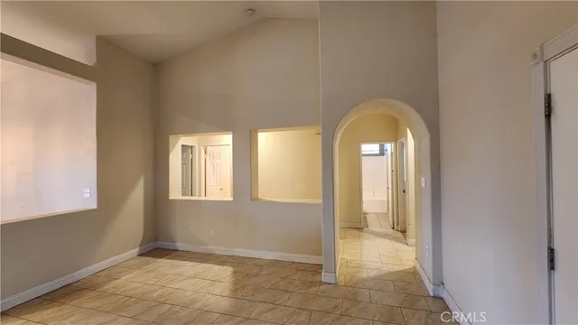 a view of a livingroom with wooden floor and a window