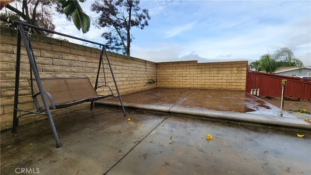 a view of a backyard with chairs