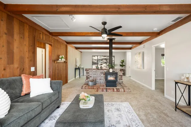 a kitchen with stainless steel appliances granite countertop a refrigerator a stove and a sink with cabinets