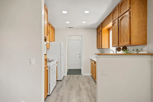 a kitchen with a stove and a sink