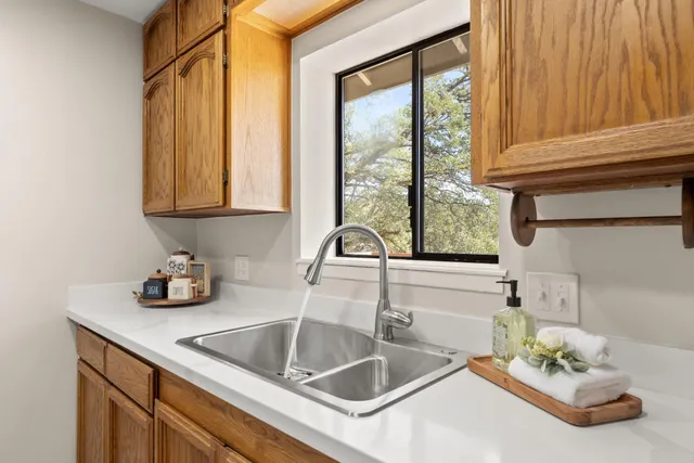 a spacious bedroom with a bed and a chair