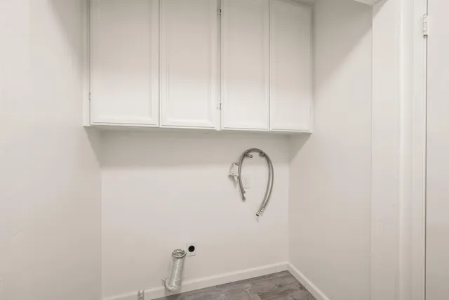 a bedroom with a bed a lamp and a chandelier