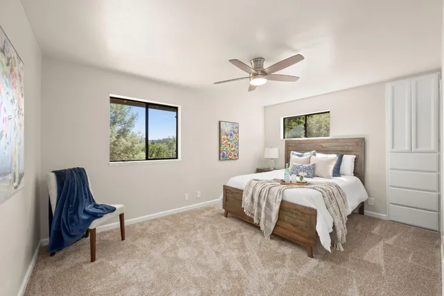 a bath room with a toilet and a bath tub