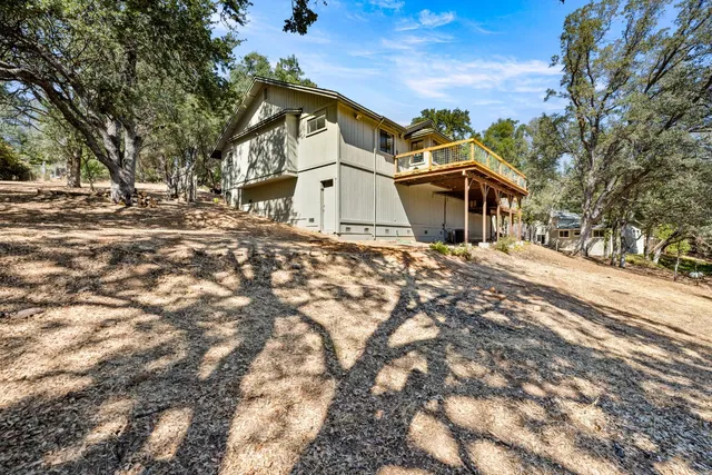 a aerial view of a house with a yard and sitting space