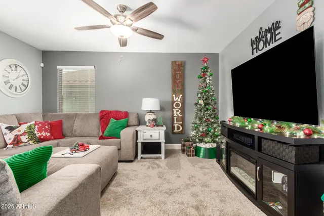 a bedroom with furniture and a flat screen tv