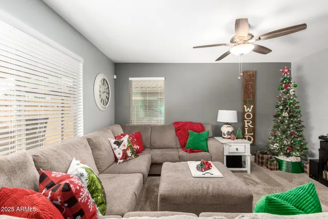 a bedroom with a bed and dresser with mirror