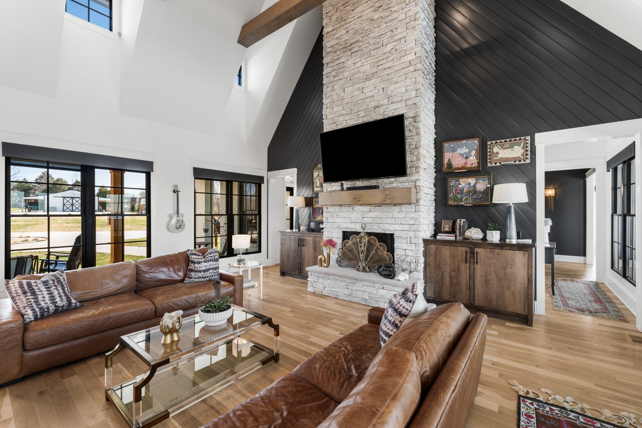 1770 Lockertsville Road Ashland City, TN 37015 - Photo 15 of 95 a living room with furniture a flat screen tv and a fireplace