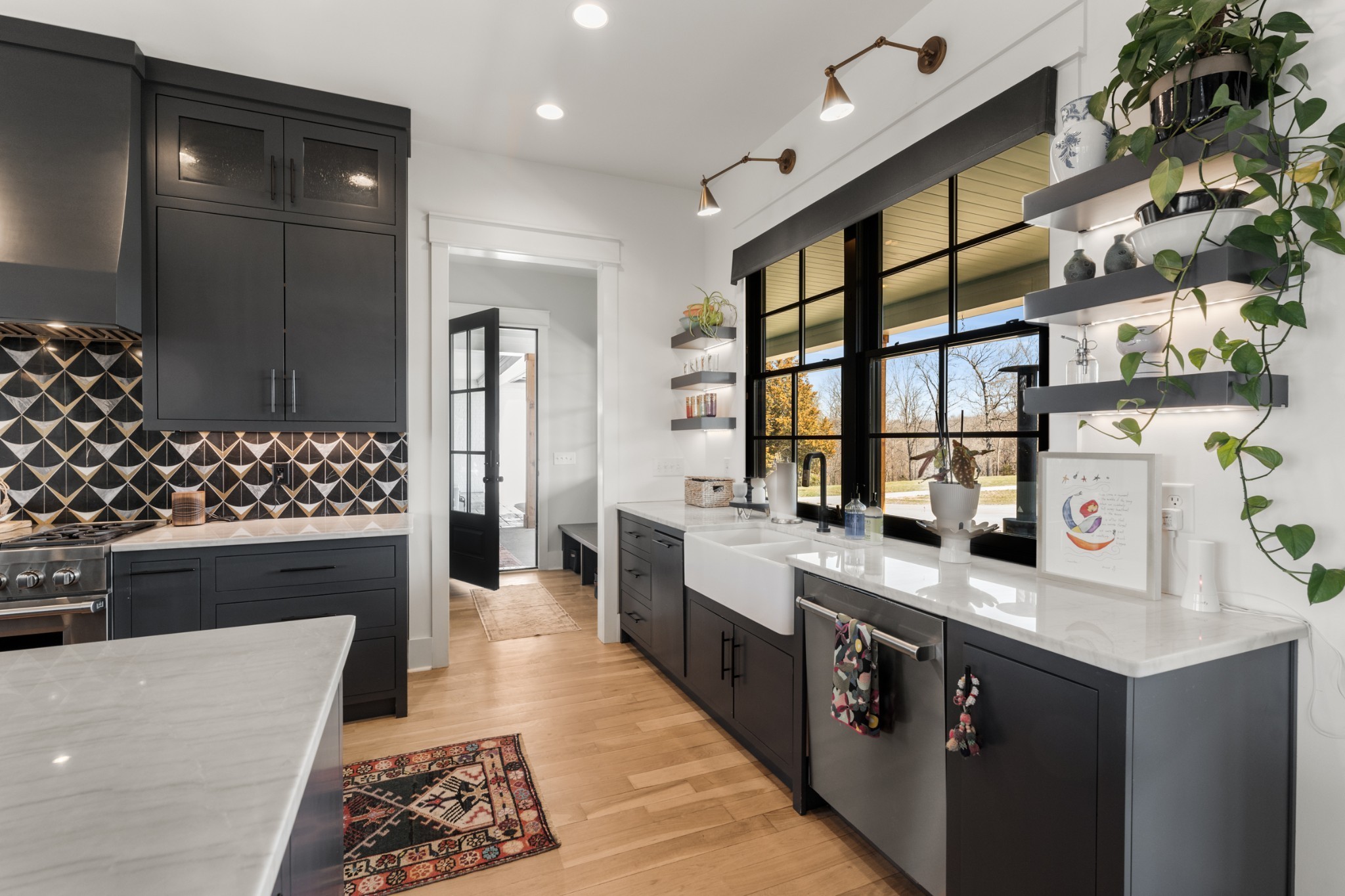 1770 Lockertsville Road Ashland City, TN 37015 - Photo 19 of 95 a large kitchen with stainless steel appliances granite countertop a stove a sink and a refrigerator