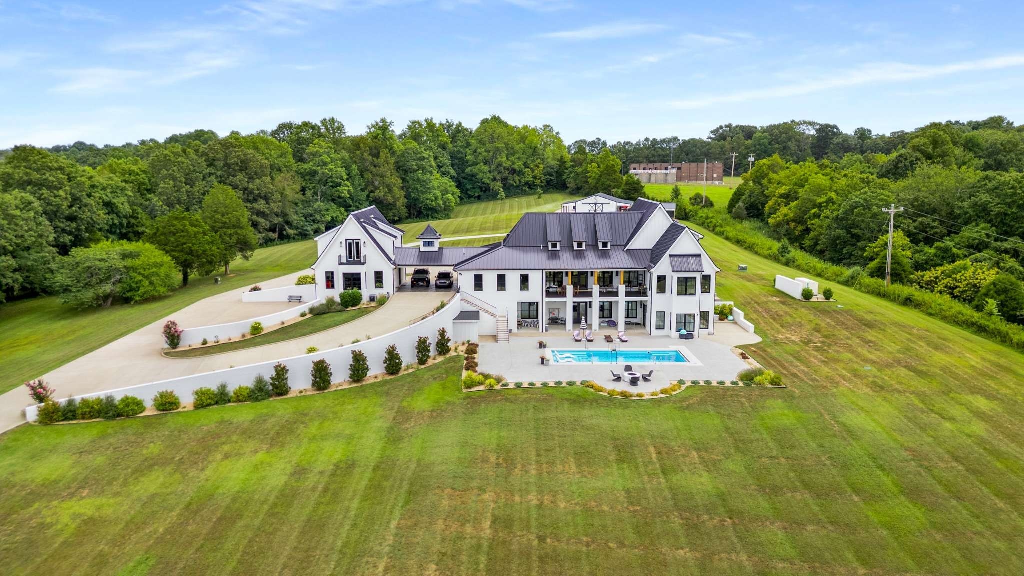 1770 Lockertsville Road Ashland City, TN 37015 - Photo 5 of 95 an aerial view of a house with swimming pool garden and mountain view