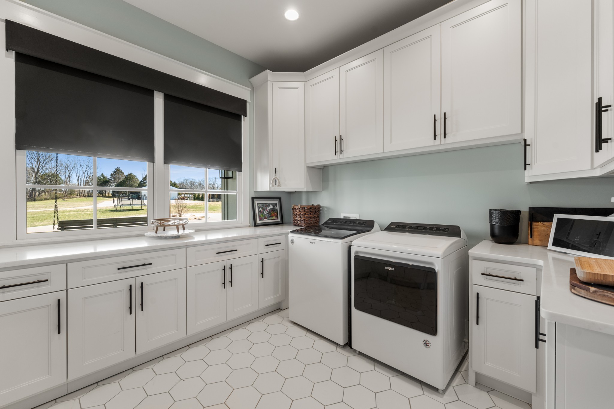 1770 Lockertsville Road Ashland City, TN 37015 - Photo 52 of 95 a kitchen with white cabinets and white appliances