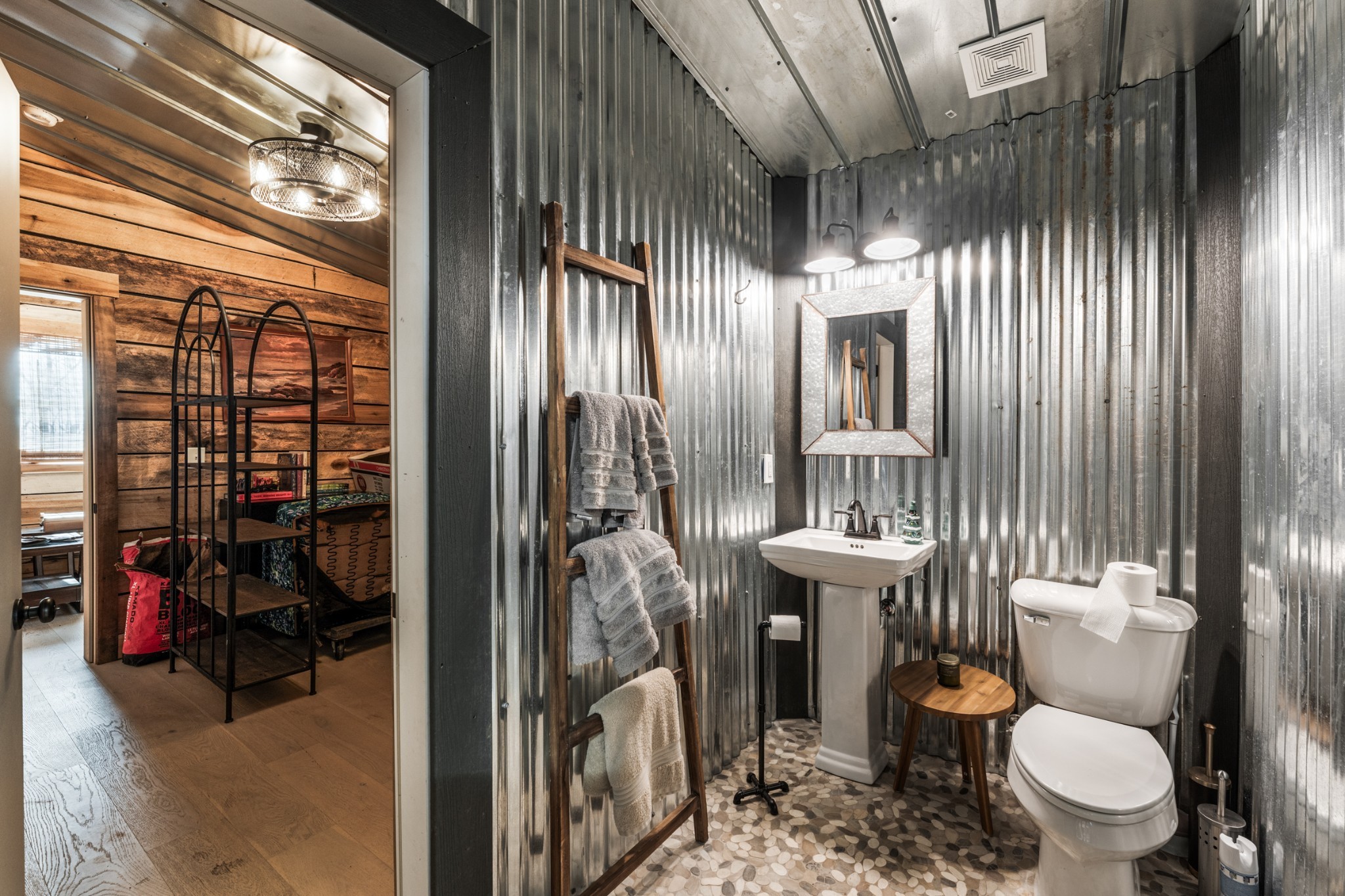 1770 Lockertsville Road Ashland City, TN 37015 - Photo 57 of 95 a bathroom with a toilet a sink and a large mirror