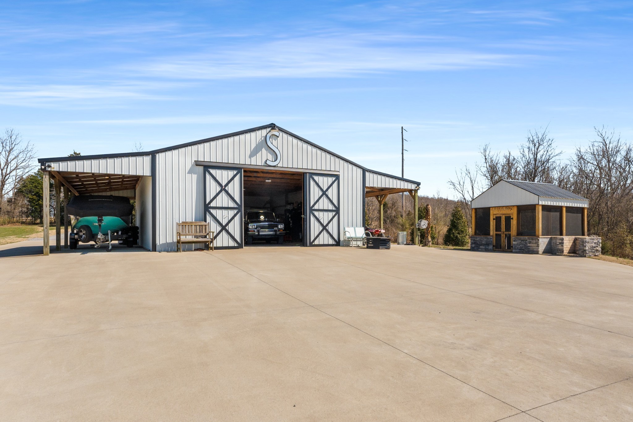 1770 Lockertsville Road Ashland City, TN 37015 - Photo 72 of 95 a front view of a house with a yard and garage