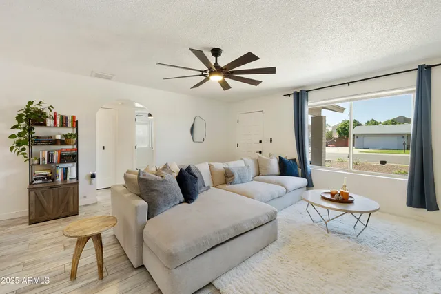 a living room with furniture and a window