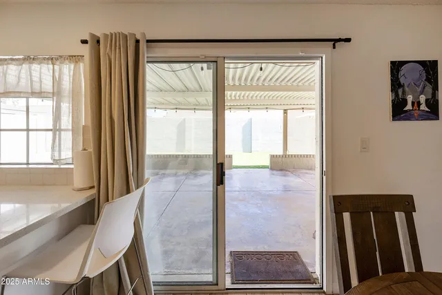 a view of a room with a large window