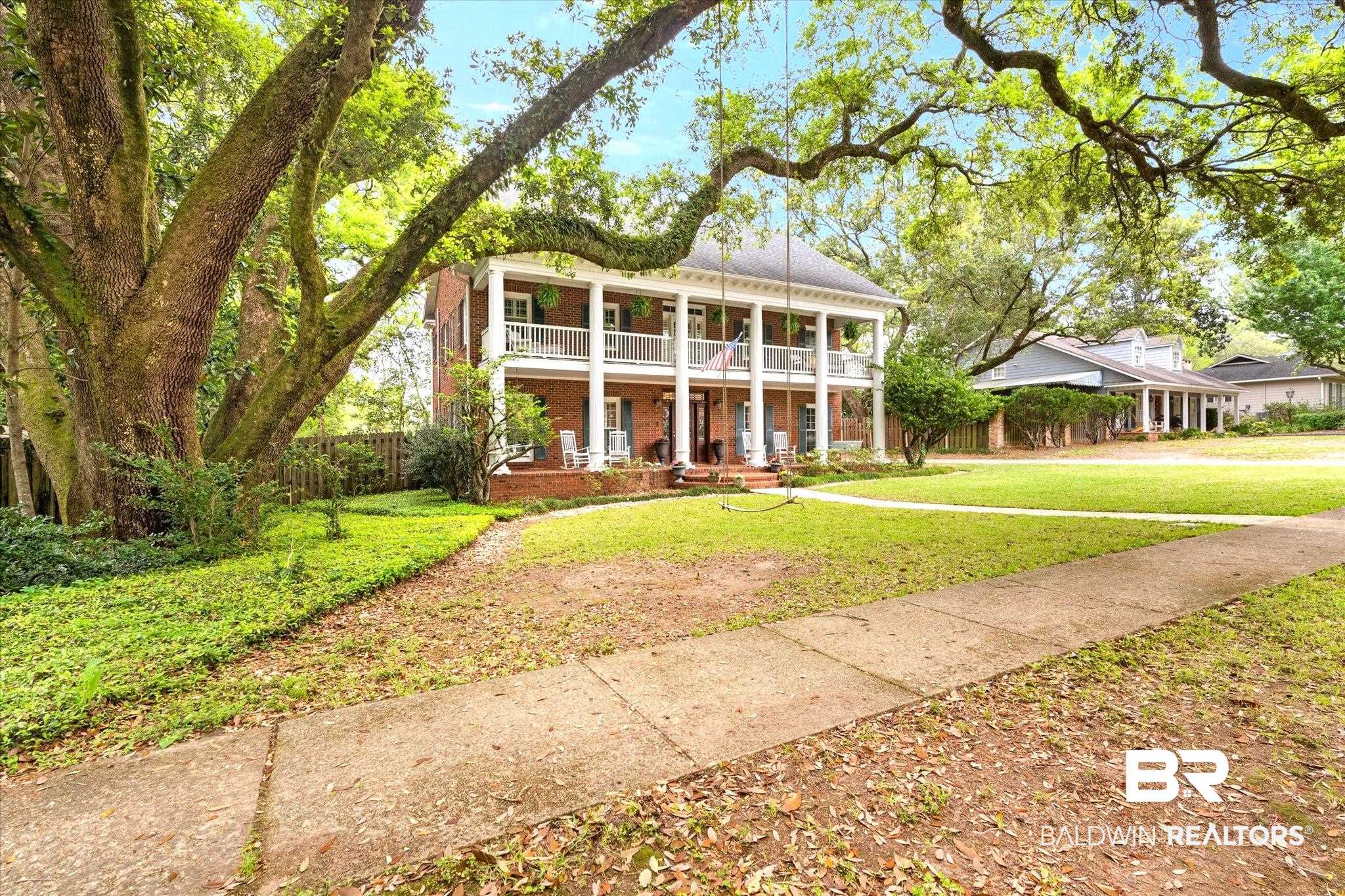 5324 Oak Bend Court Mobile, AL 36609 - Photo 41 of 49 Neoclassical home with a front yard, brick siding, a balcony, and covered porch