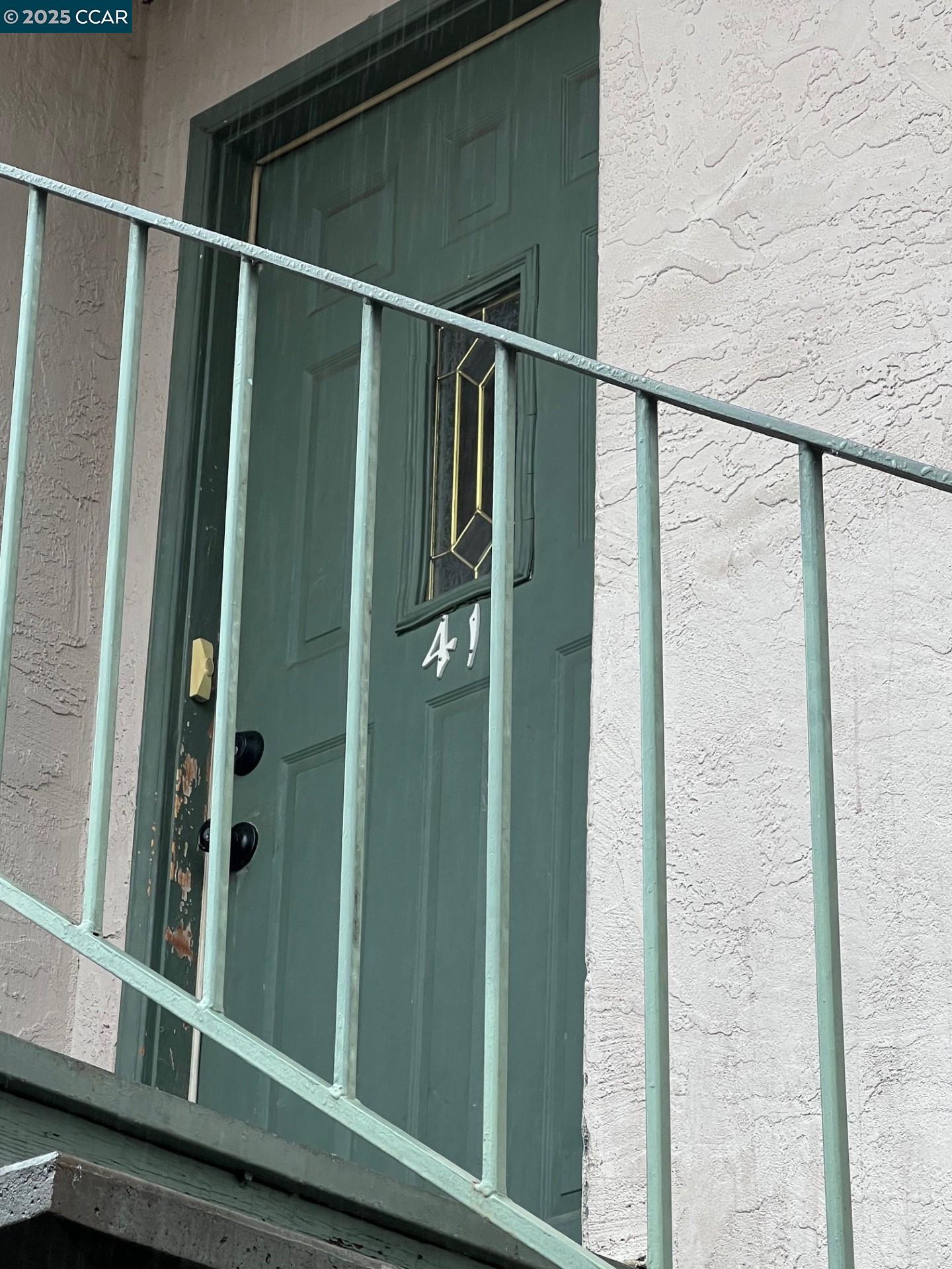 a bathroom with a shower and a mirror