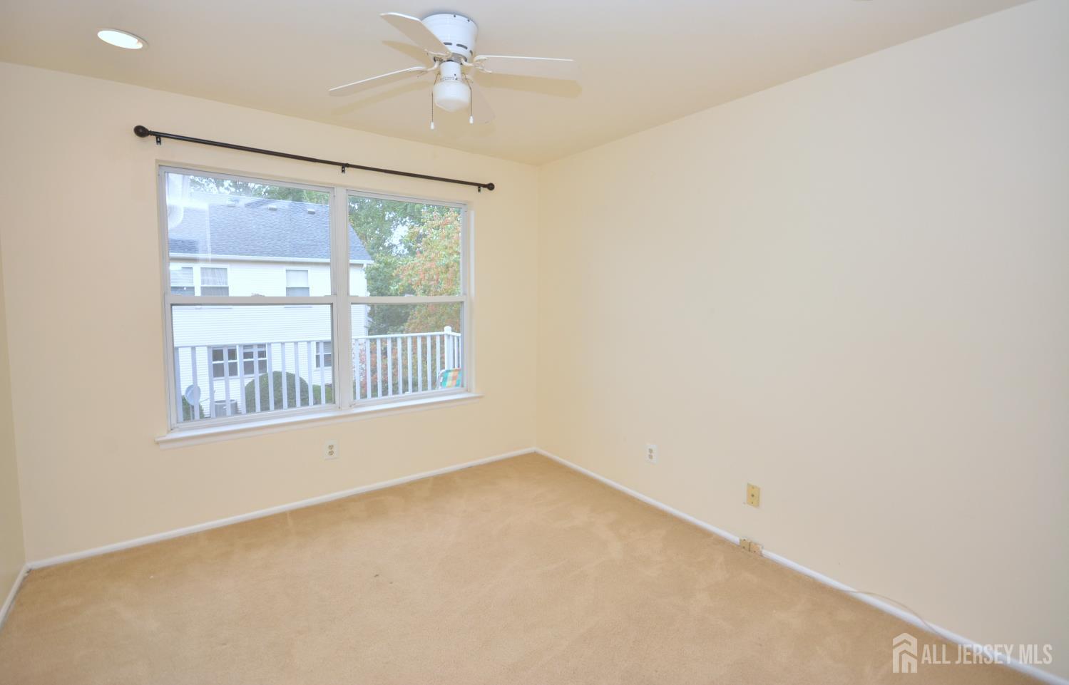 125 Exeter Court Piscataway, NJ 08854 - Photo 19 of 34 an empty room with a window