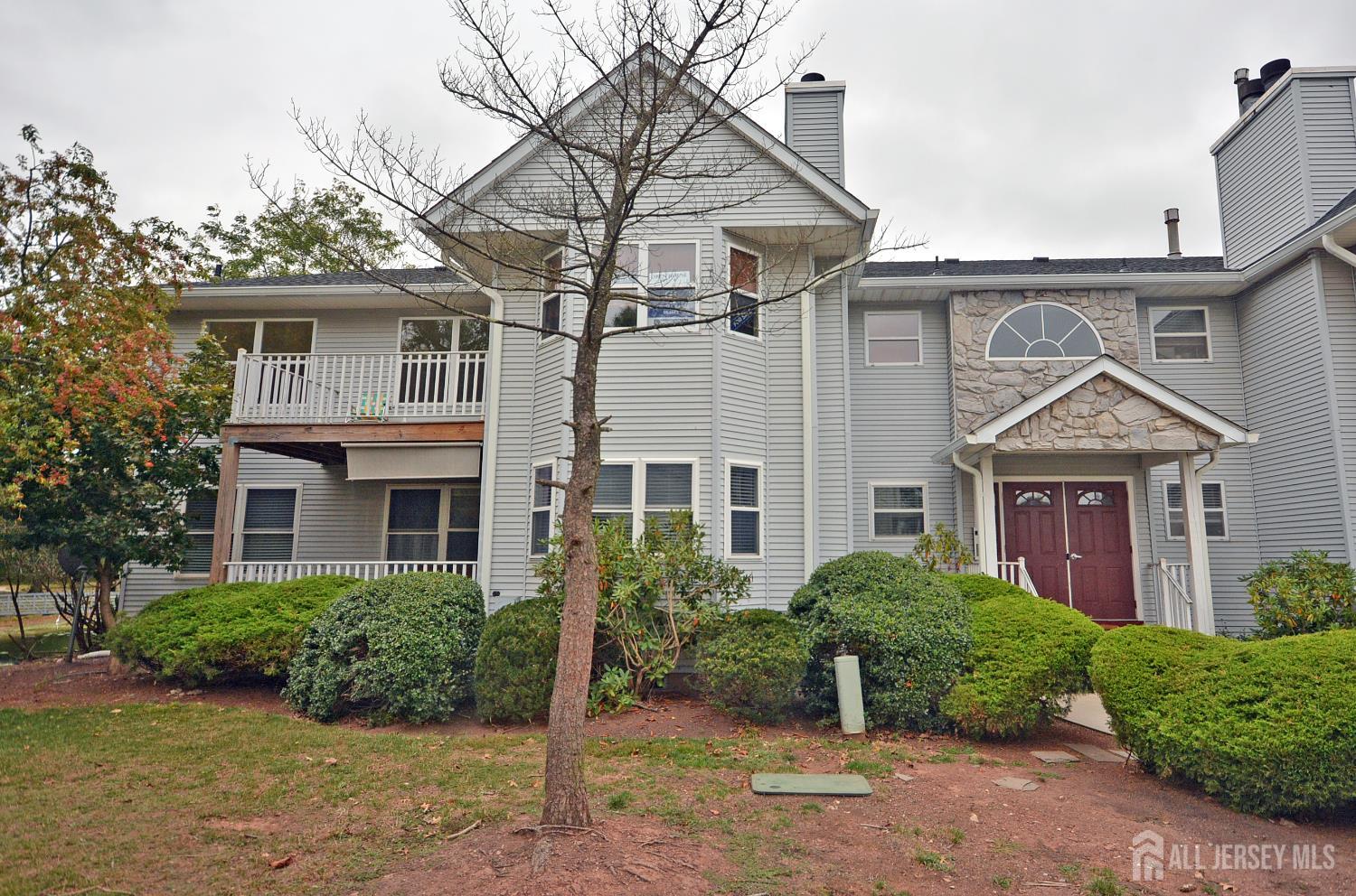 125 Exeter Court Piscataway, NJ 08854 - Photo 5 of 34 a front view of a house with a yard