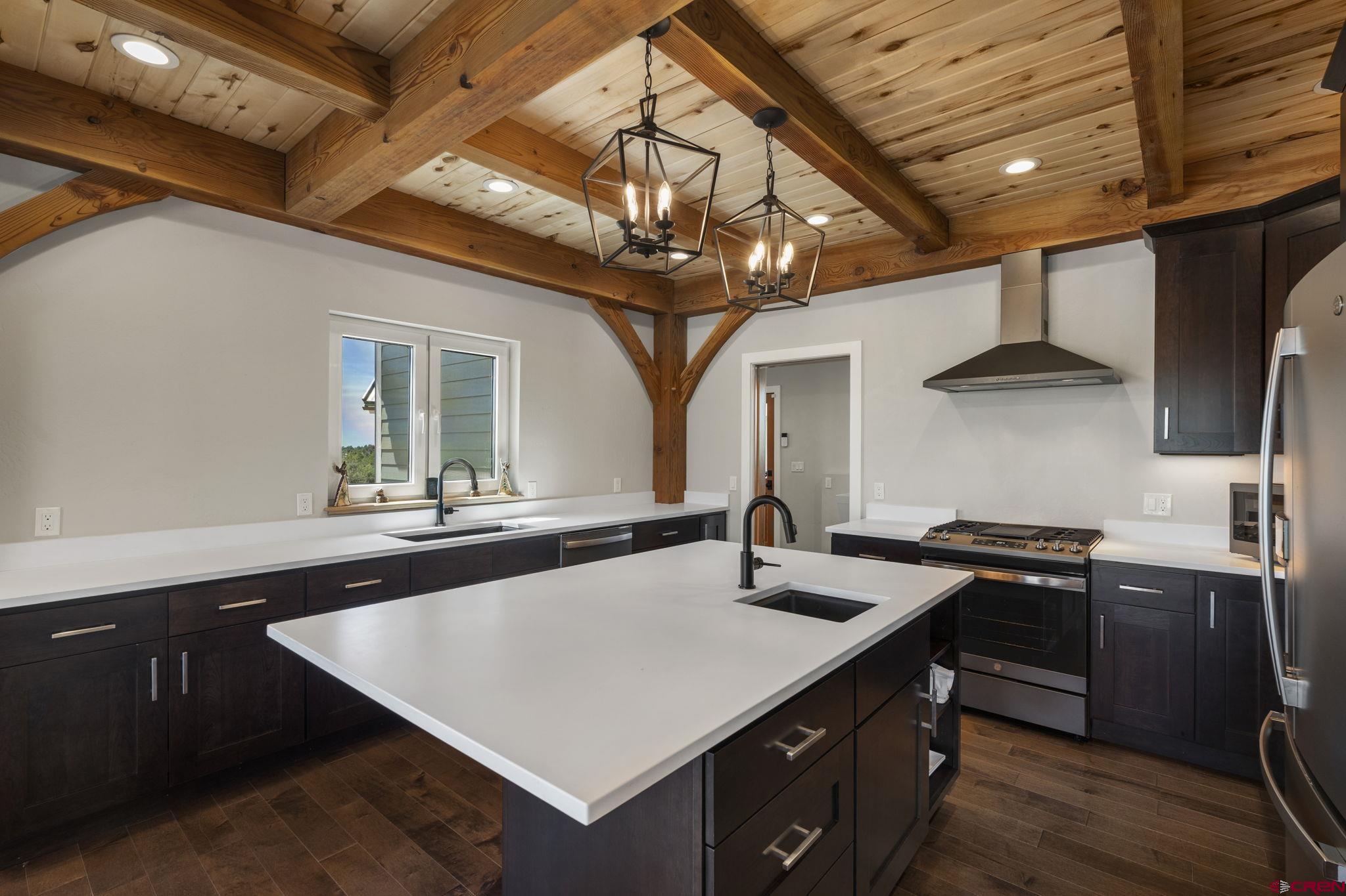 34958 Rd P.2 Mancos, CO 81328 - Photo 12 of 44 a kitchen with stainless steel appliances granite countertop a sink a stove and cabinets