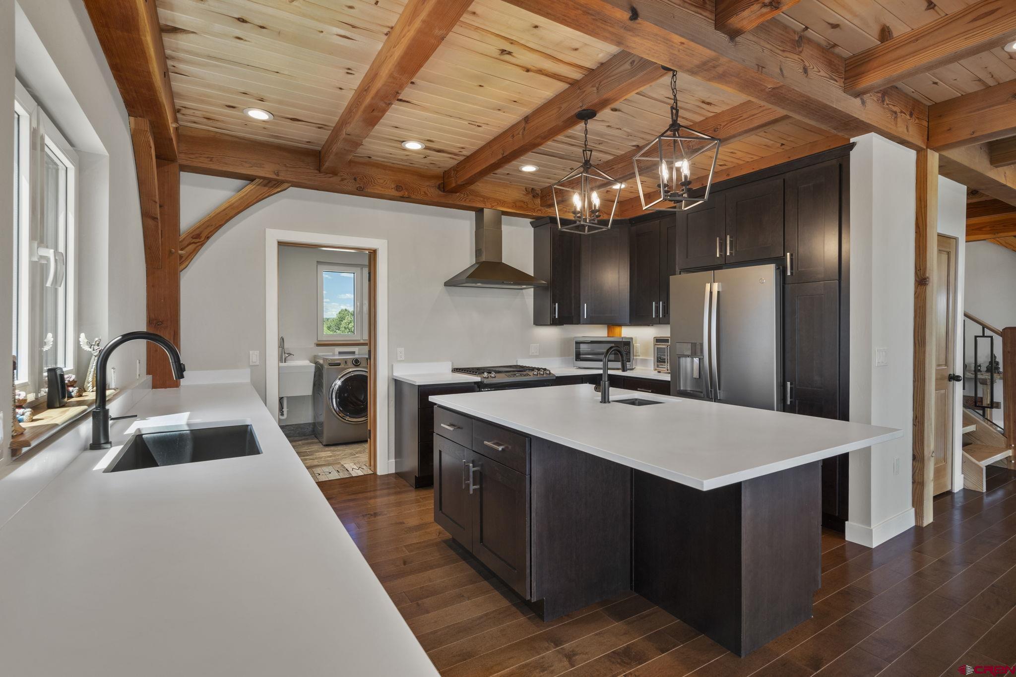 34958 Rd P.2 Mancos, CO 81328 - Photo 13 of 44 a large kitchen with stainless steel appliances a large counter top