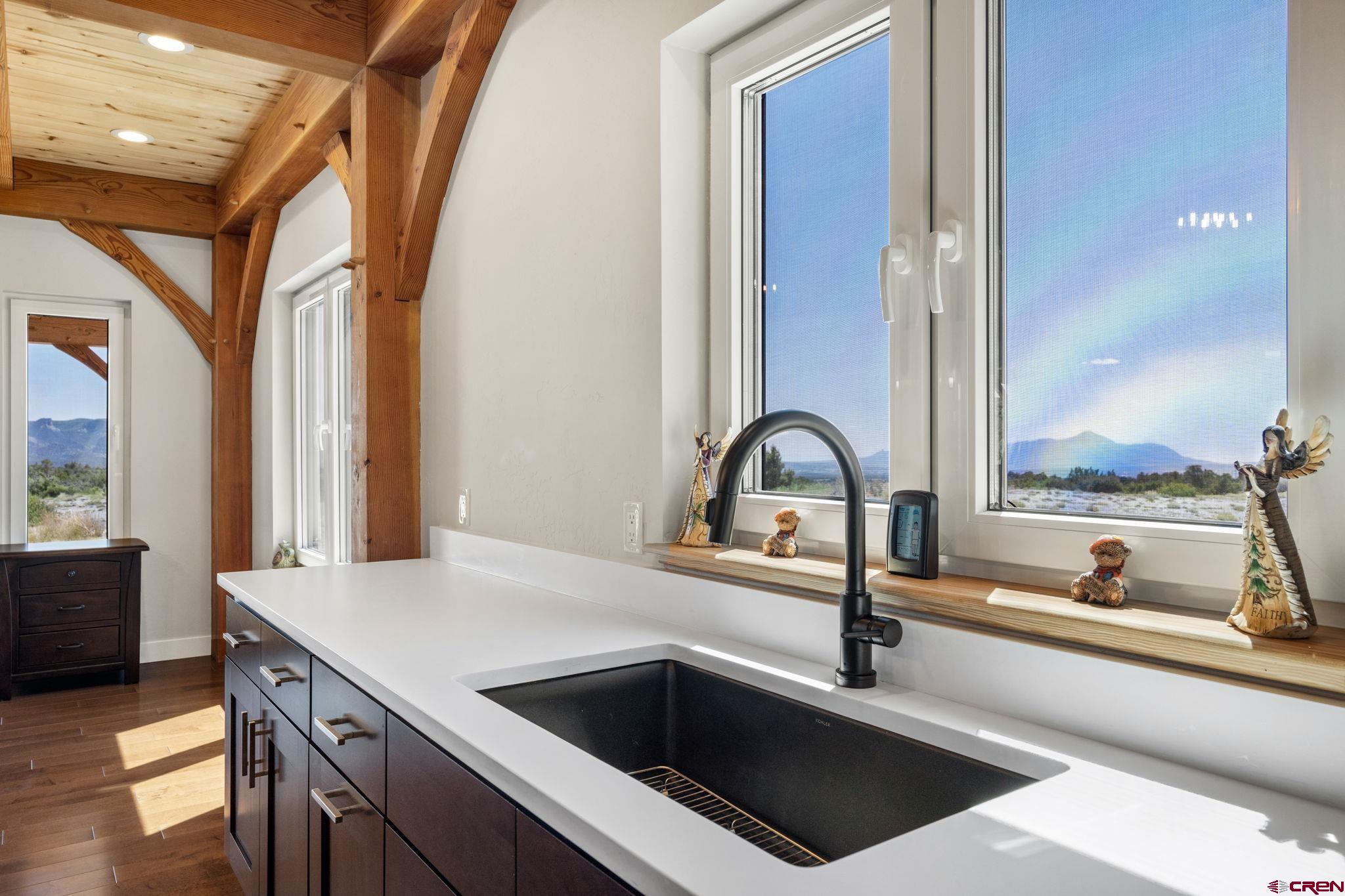 34958 Rd P.2 Mancos, CO 81328 - Photo 14 of 44 a kitchen with a sink and a stove with wooden floor