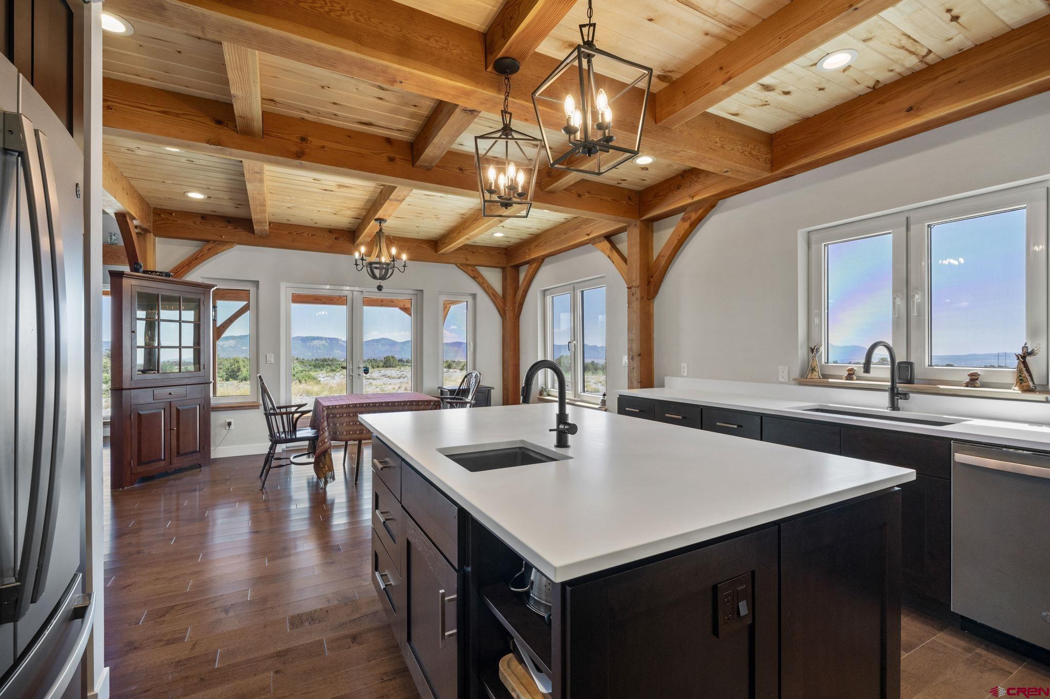 34958 Rd P.2 Mancos, CO 81328 - Photo 15 of 44 a kitchen with a table chairs and wooden floor