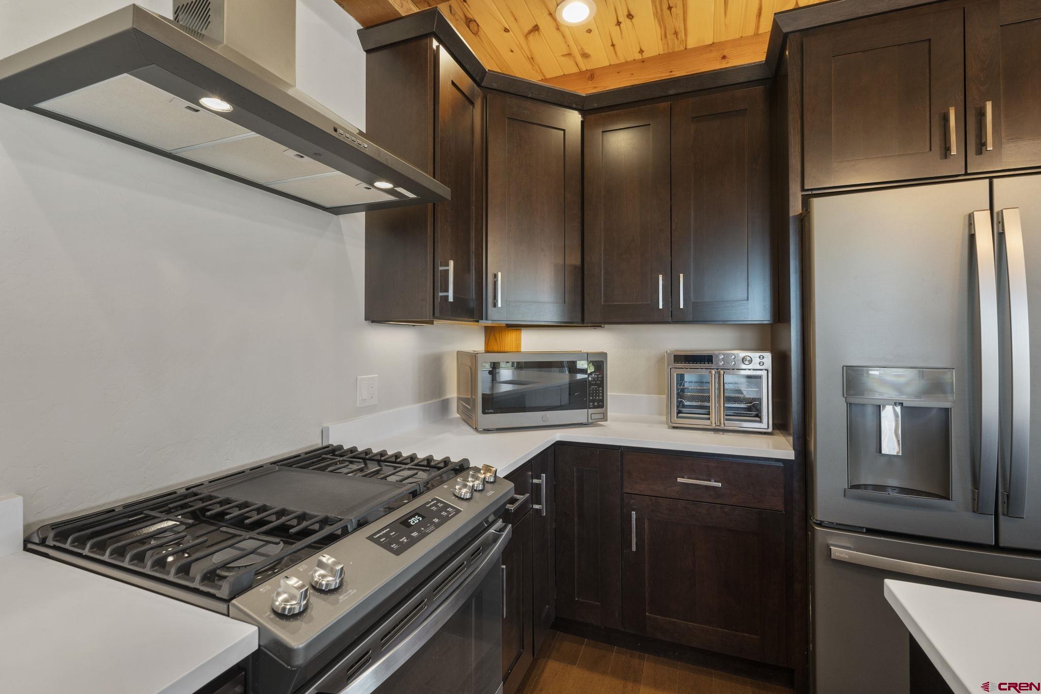 34958 Rd P.2 Mancos, CO 81328 - Photo 16 of 44 a kitchen with stainless steel appliances granite countertop a refrigerator and a stove