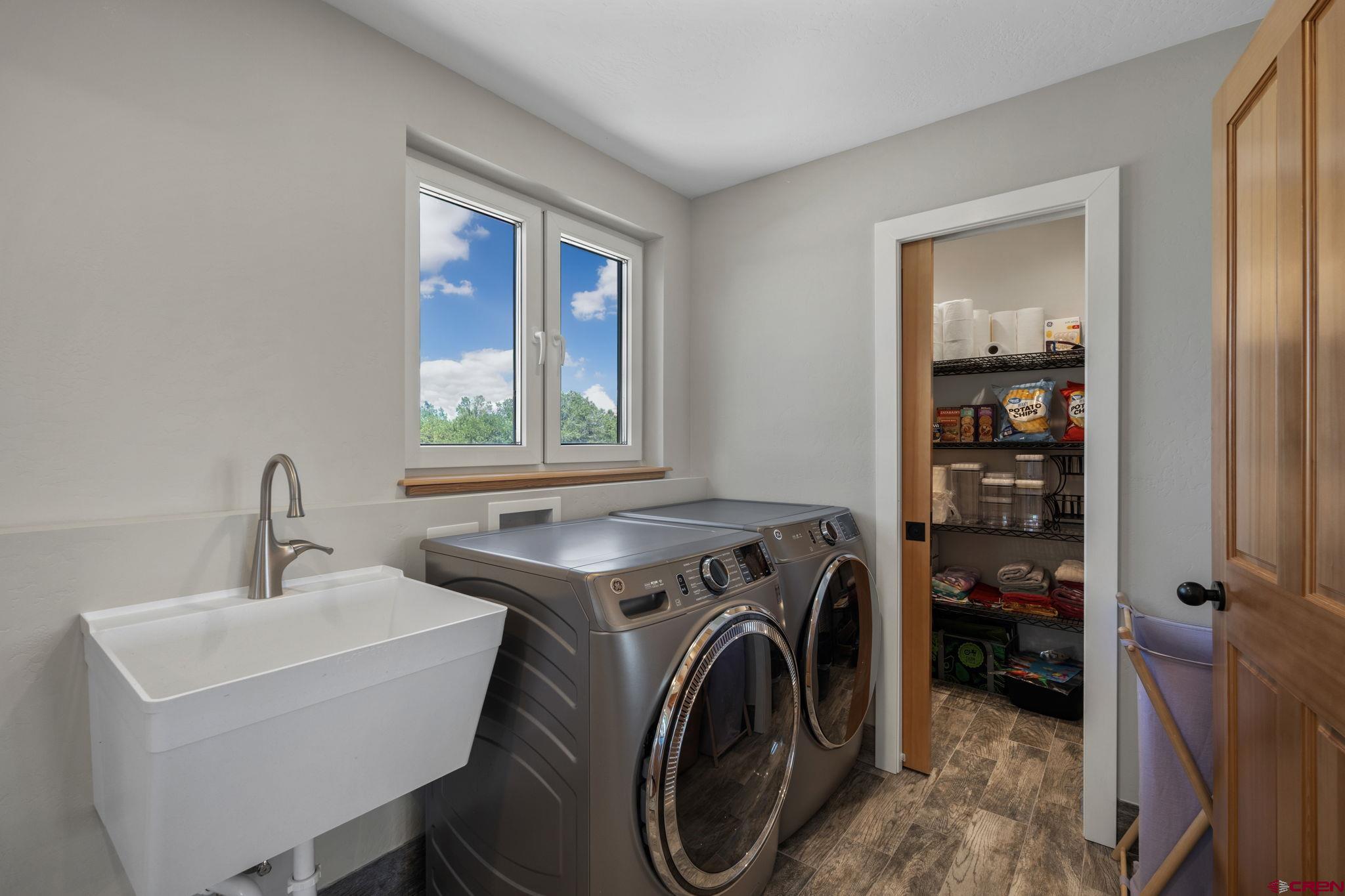 34958 Rd P.2 Mancos, CO 81328 - Photo 18 of 44 a utility room with dryer washer and a window