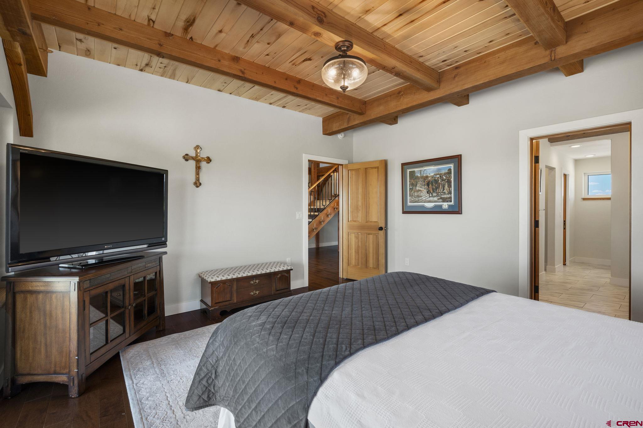 34958 Rd P.2 Mancos, CO 81328 - Photo 20 of 44 a bedroom with a bed and a flat screen tv