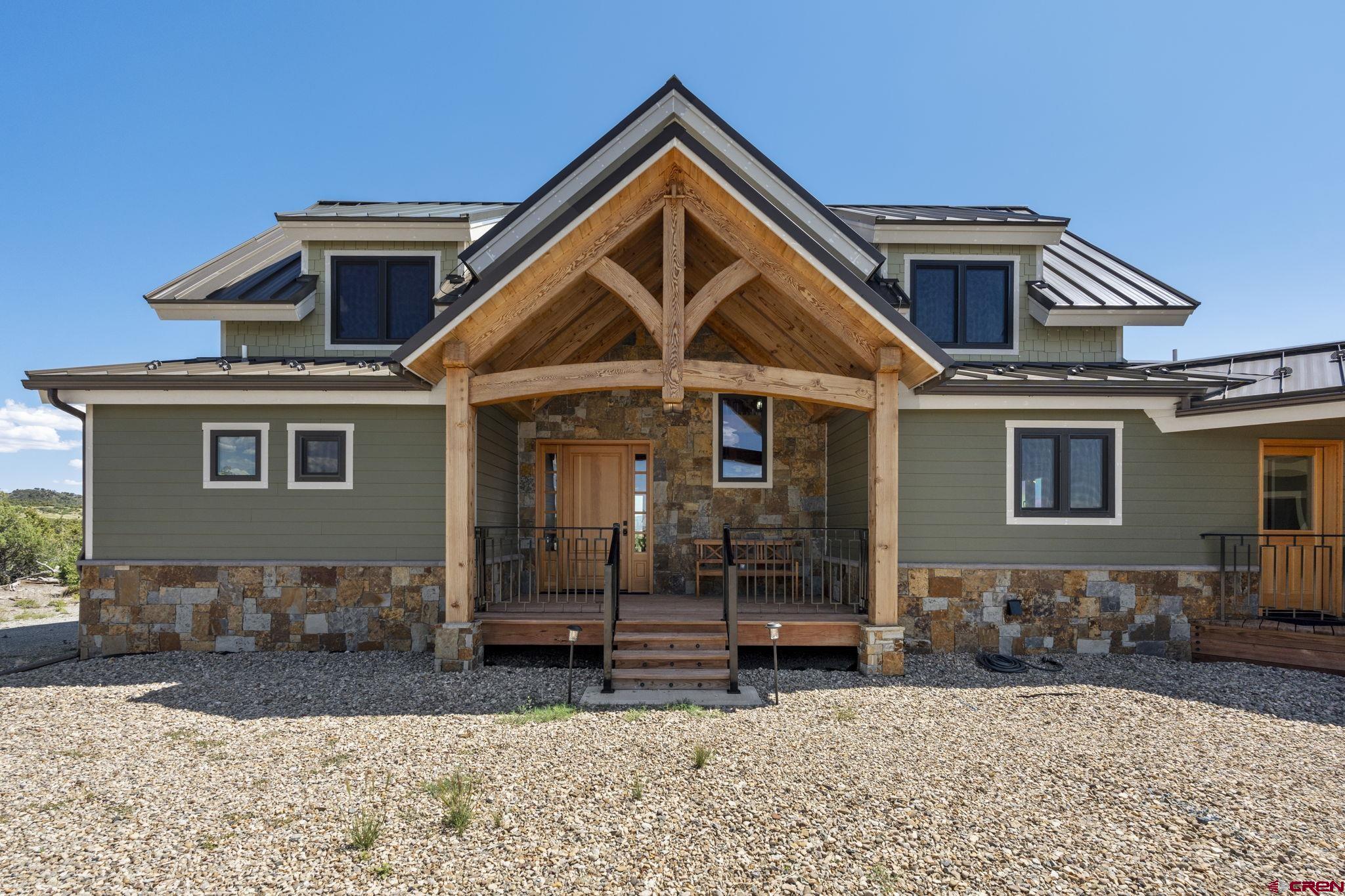 34958 Rd P.2 Mancos, CO 81328 - Photo 2 of 44 a front view of a house with a yard