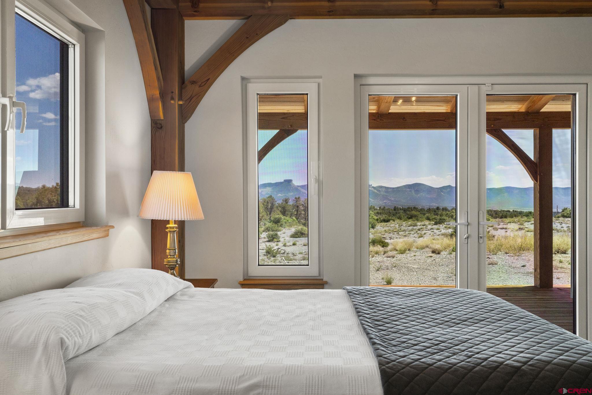 34958 Rd P.2 Mancos, CO 81328 - Photo 22 of 44 a bedroom with a large bed and a window