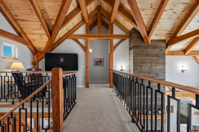 a view of a porch with wooden stairs and stairs