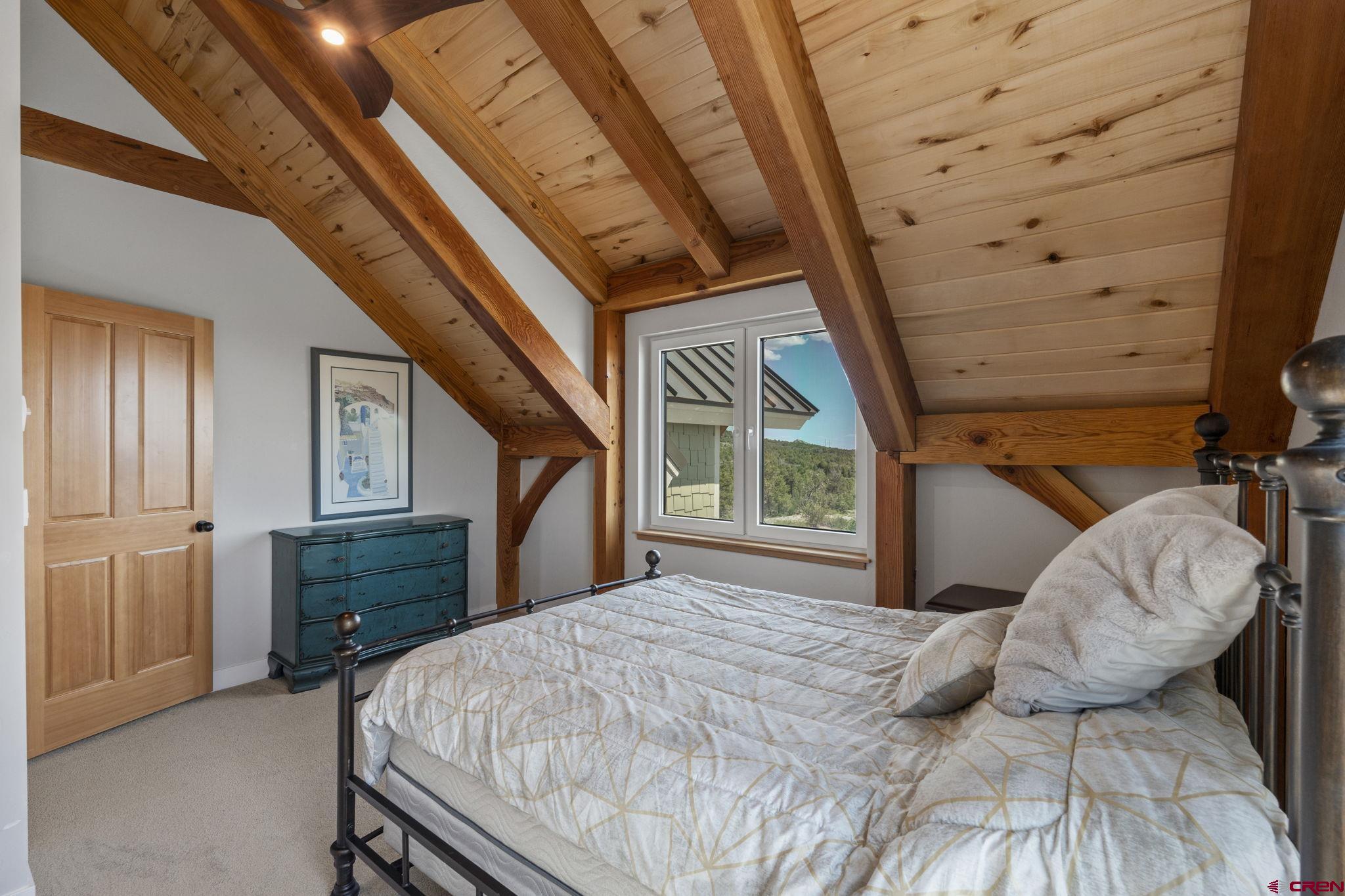 34958 Rd P.2 Mancos, CO 81328 - Photo 30 of 44 a bedroom with a bed and a dresser