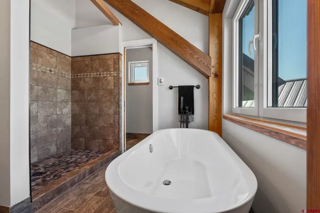 a bathroom with a sink and shower