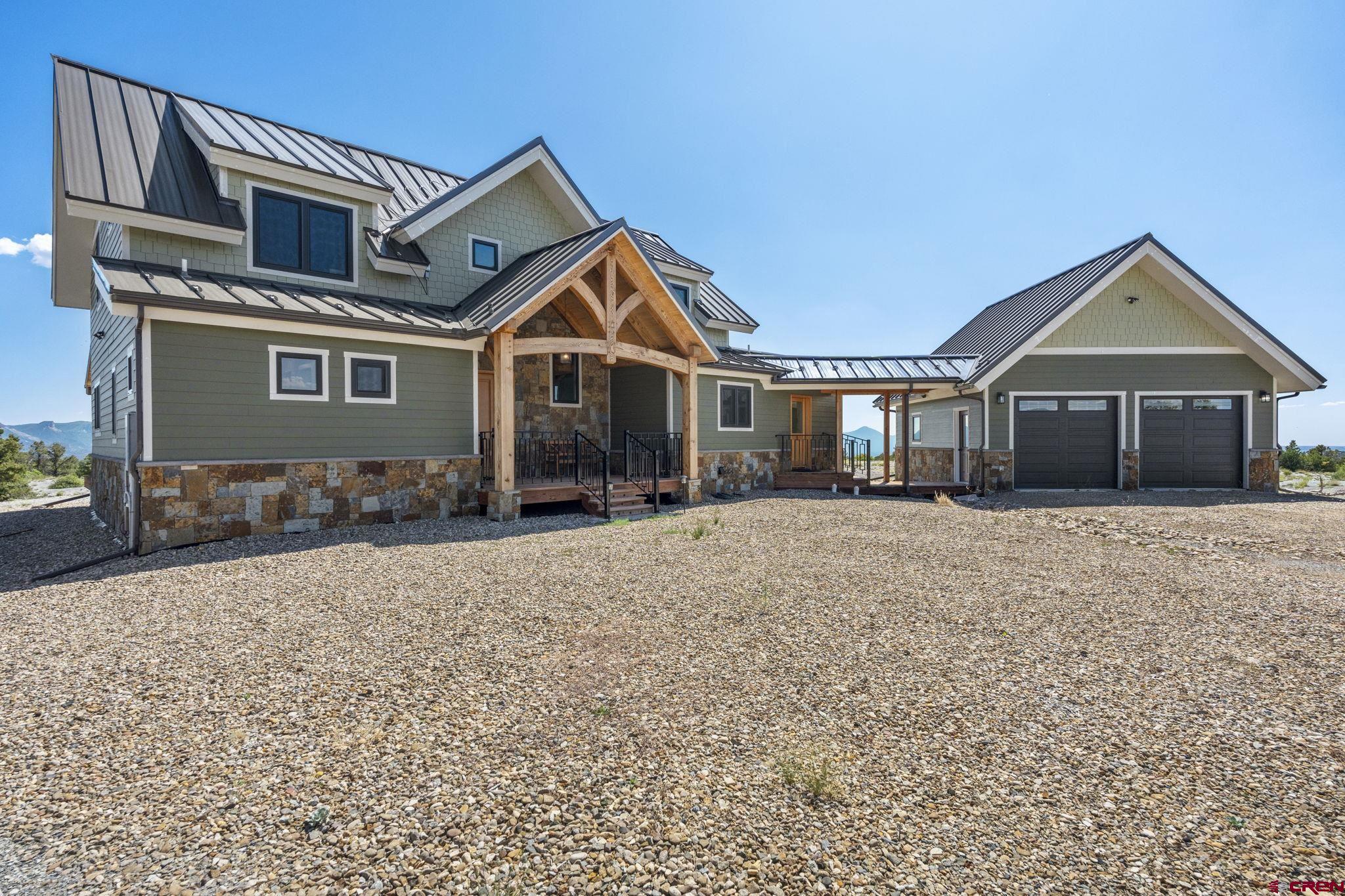 34958 Rd P.2 Mancos, CO 81328 - Photo 36 of 44 a front view of a house with a yard