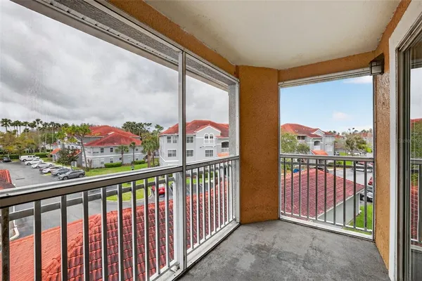 a view of balcony with furniture