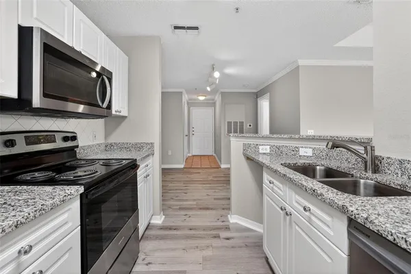 a kitchen with a stove and a sink