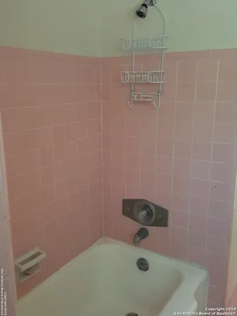 a bathroom with a bath tub