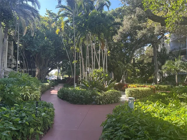 a view of outdoor space with palm trees