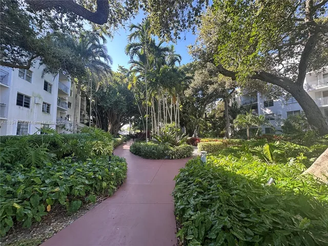 a view of a swimming pool with a table and chairs