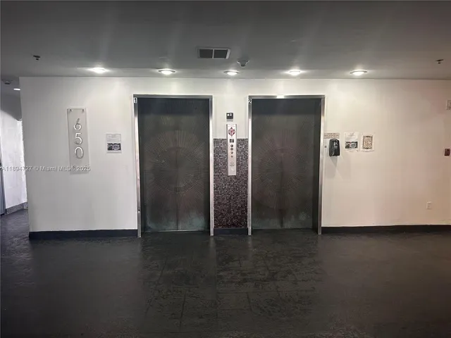 a front view of a house with a yard and outdoor seating