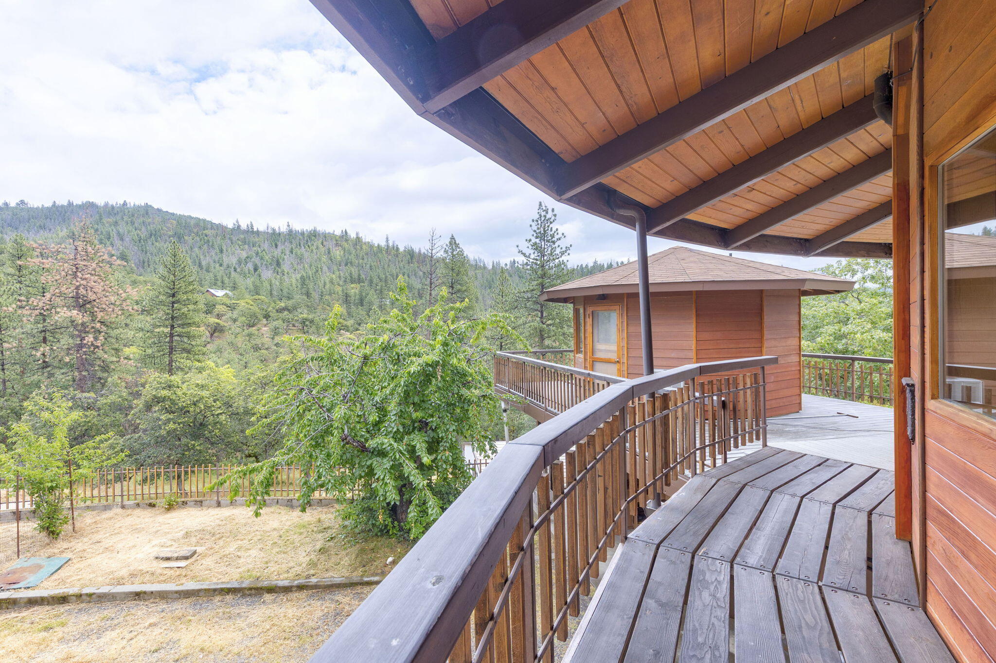 9595 Sterling Creek Road Jacksonville, OR 97530 - Photo 36 of 76 a view of balcony with wooden floor and fence