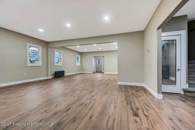 a view of a kitchen with a sink and a refrigerator